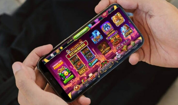 Two Hands holding a Mobile Phone Showing Slot Games that offer bonuses and promotions