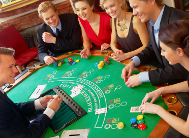 Men and Women sitting playing café casino game