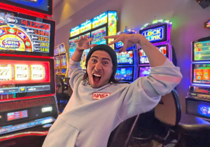 a man celebrating after playing a slot game 